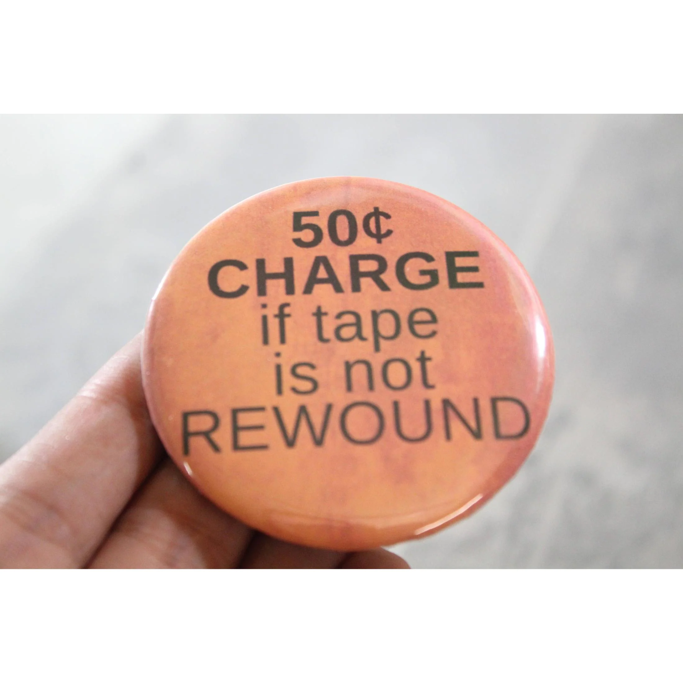 50 Cent Charge If Tape is Not Rewound Metal Pinbacked Button | 2.25" Large '80s Retro Button