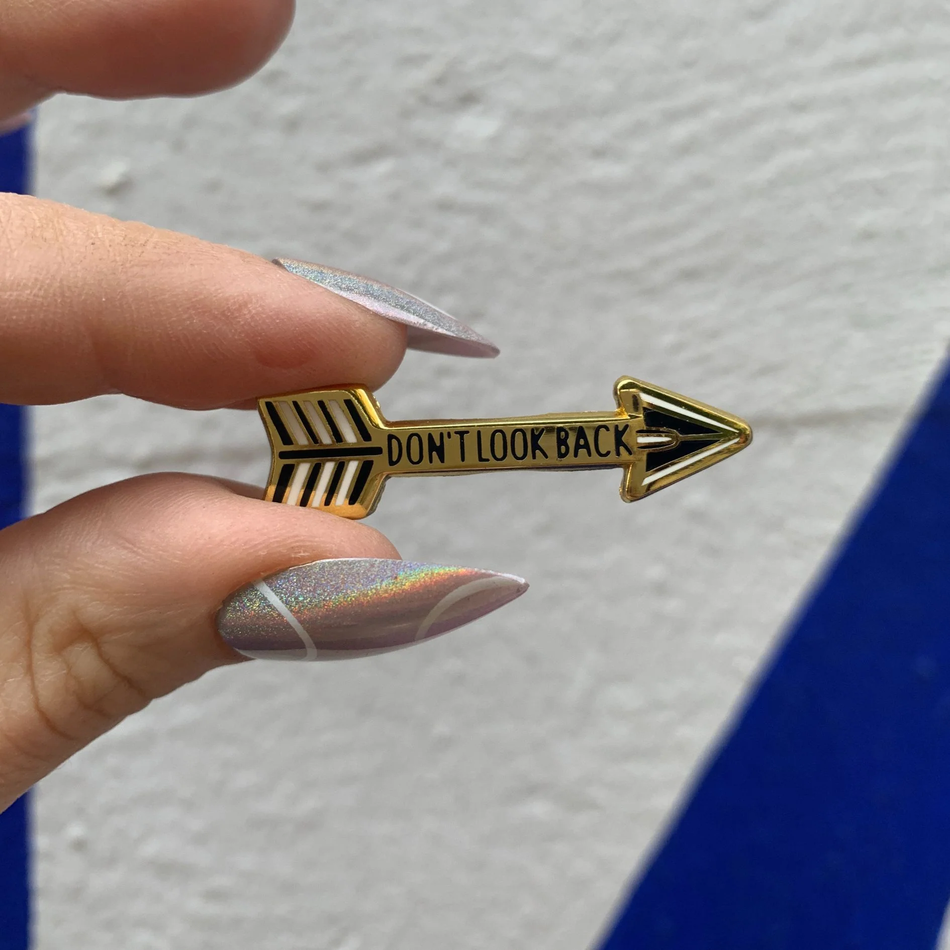 Don't Look Back Arrow Enamel Pin in Gold on Gift Card - Image 3