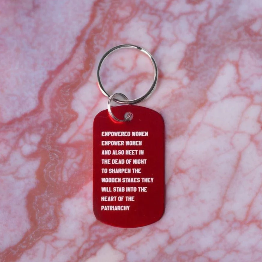 Empowered Women Empower Women And Also Meet in the Dead of Night Feminist Dog Tag Keychain in Red with Silver Lettering - Image 6