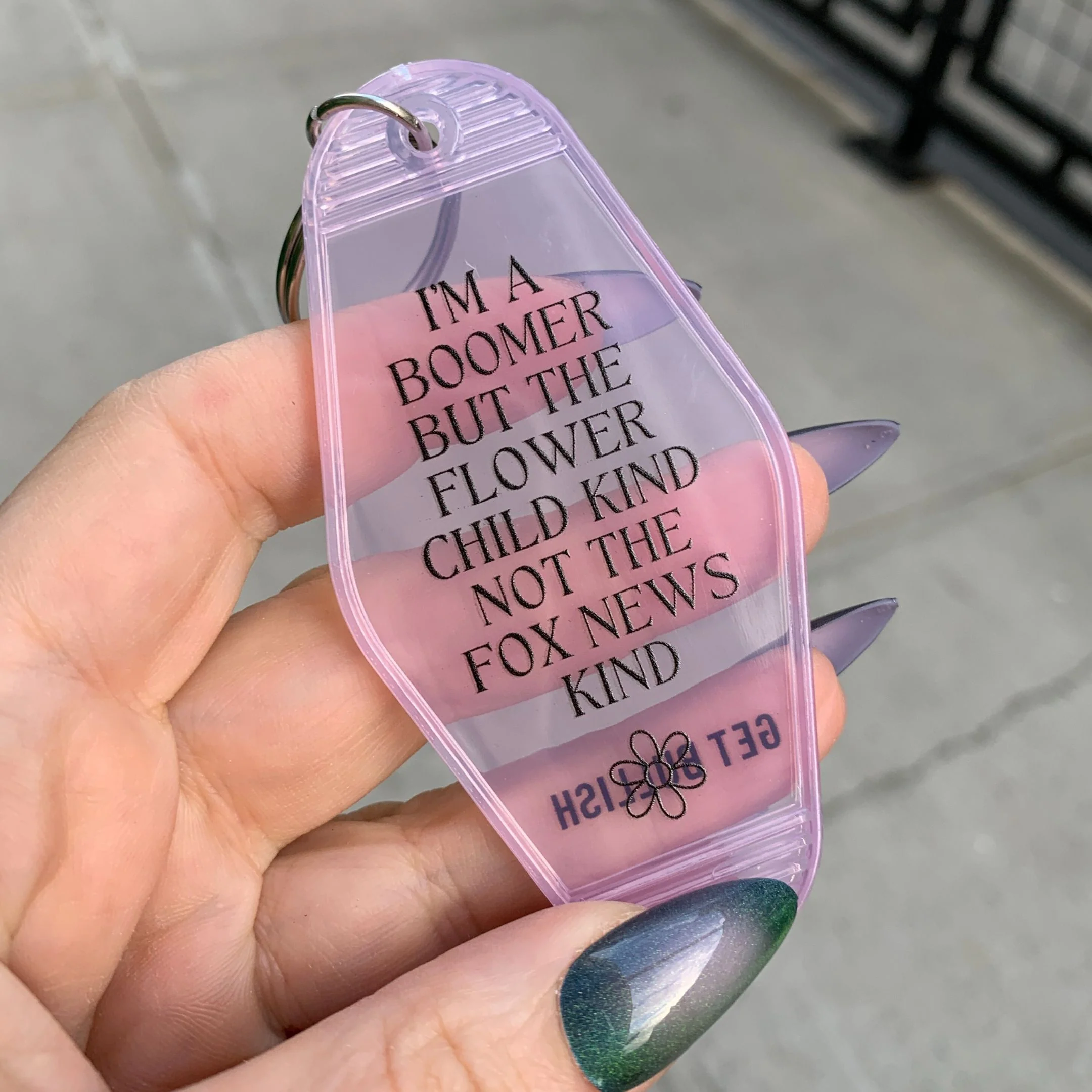 I’m a Boomer But Not the Fox News Kind Motel Style Keychain in Translucent Pink - Image 3