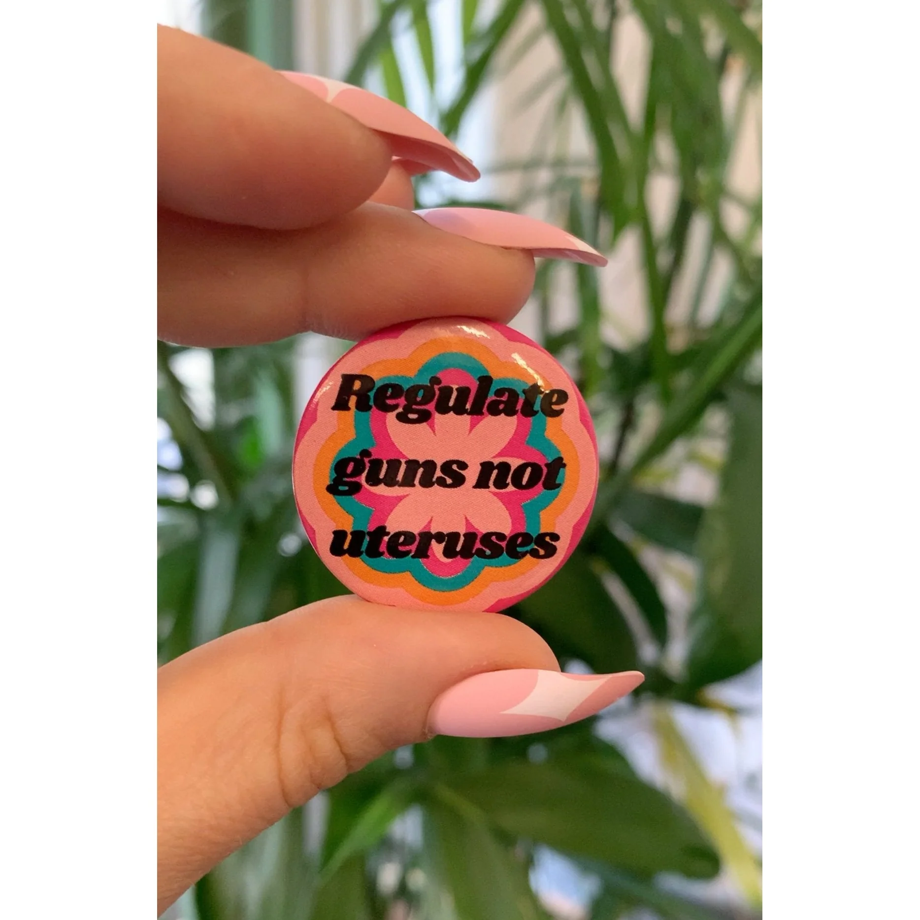 Regulate Guns Not Uteruses 1.25" Button in Groovy Flower Motif - Image 4