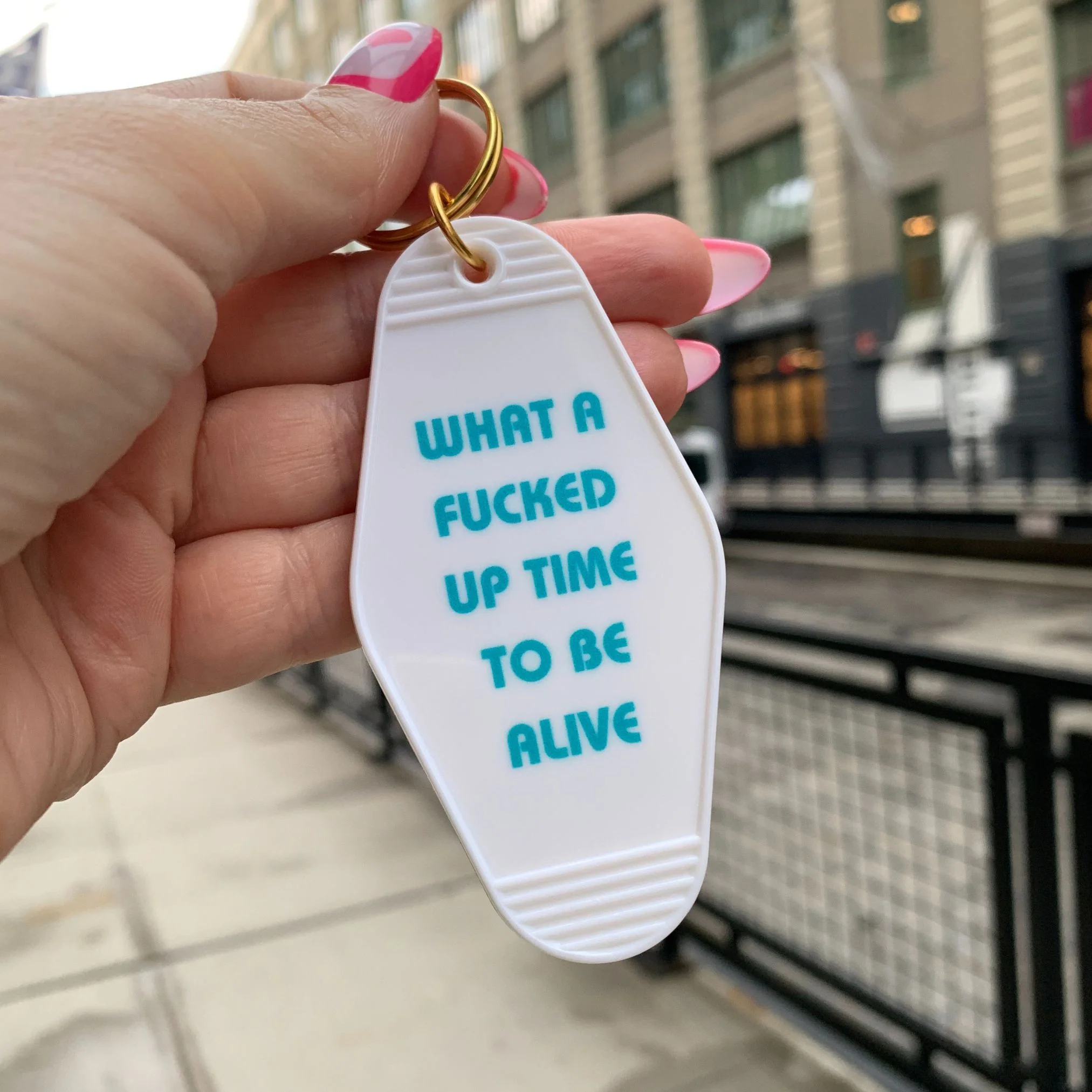 What a Fucked Up Time to Be Alive Motel Style Keychain in White - Image 3